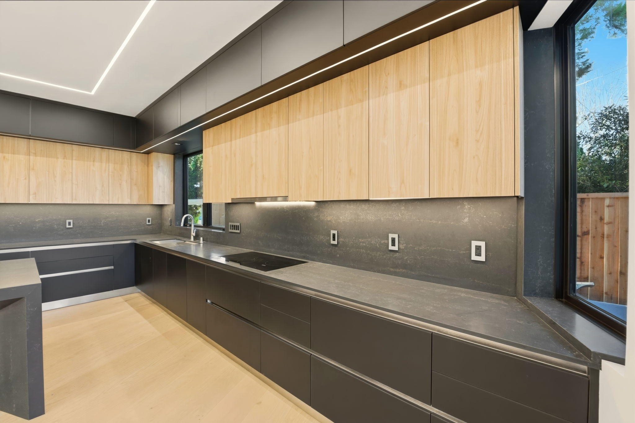 Kitchen detail — dark cabinetry, oak uppers, LED lighting
